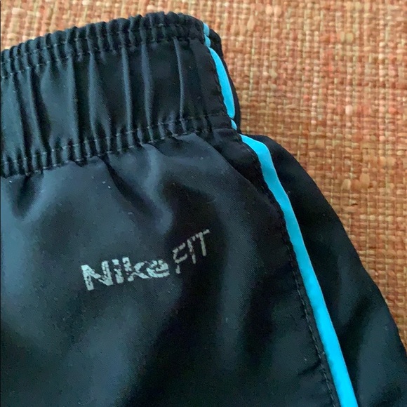 Black women’s Nike shorts with blue stripe - Picture 3 of 5